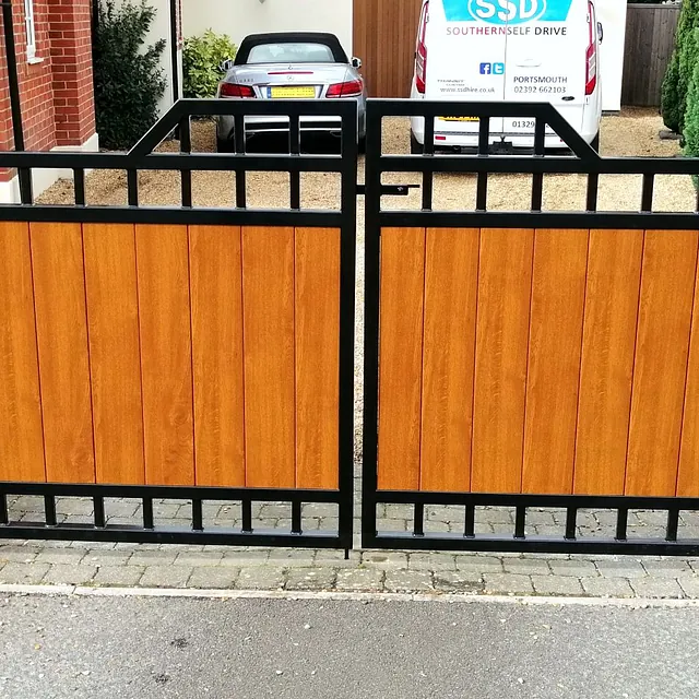 Pair of iron gates with wooden panels