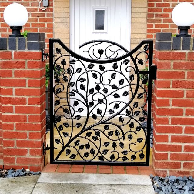 Wrought iron garden gate with leaf design