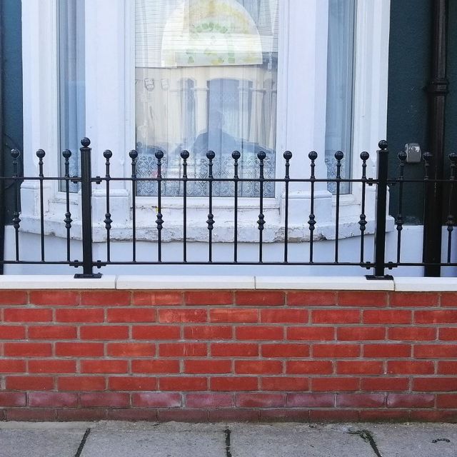 wrought iron railings on wall